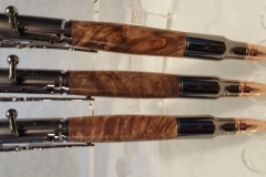 These are bun metal bolt action with stabilized wood